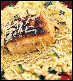 Salmon filet on orzo